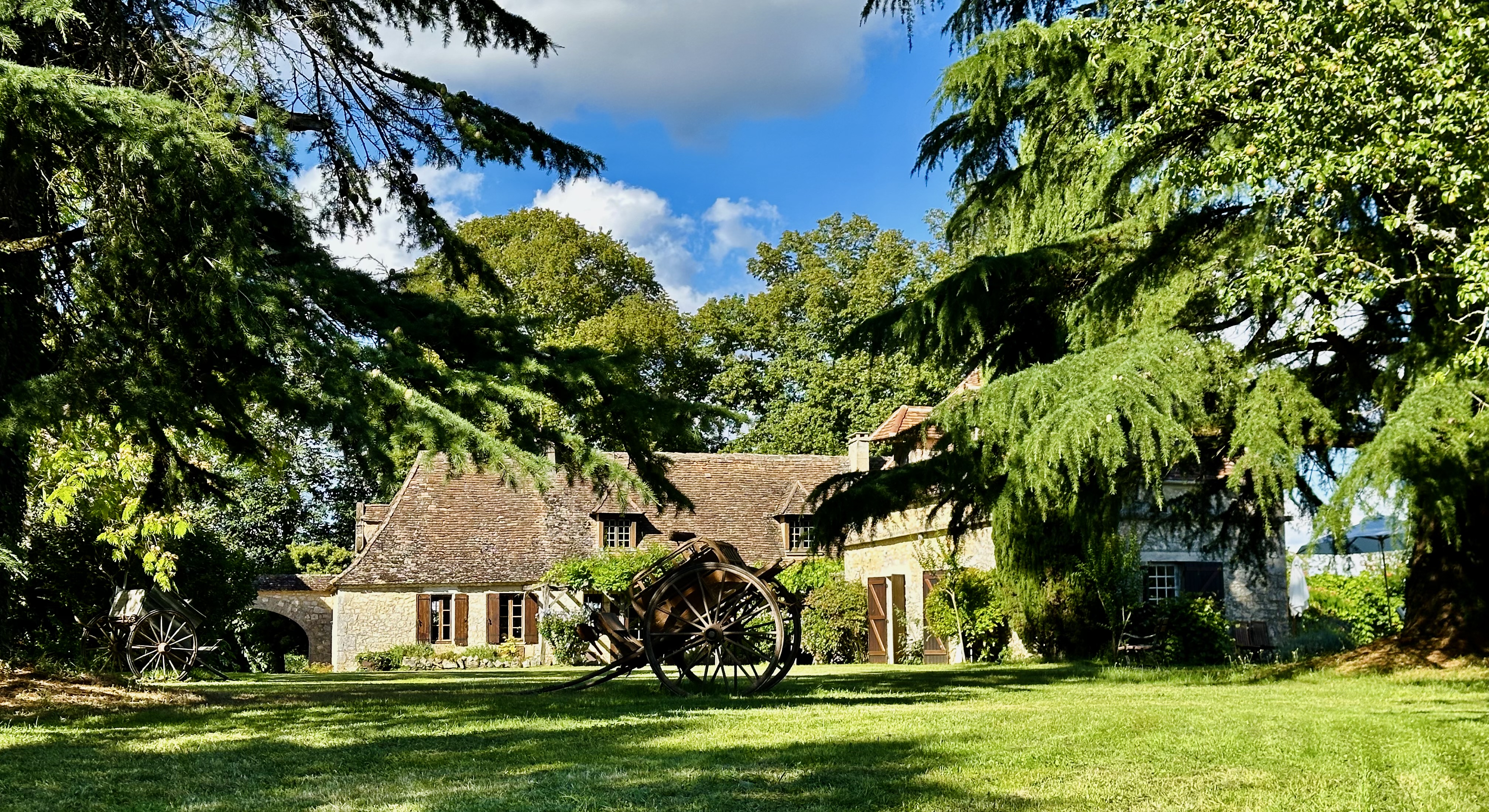 Manoir du Suquet at golden hour — the 19th-century estate and grounds, Bardou, Dordogne